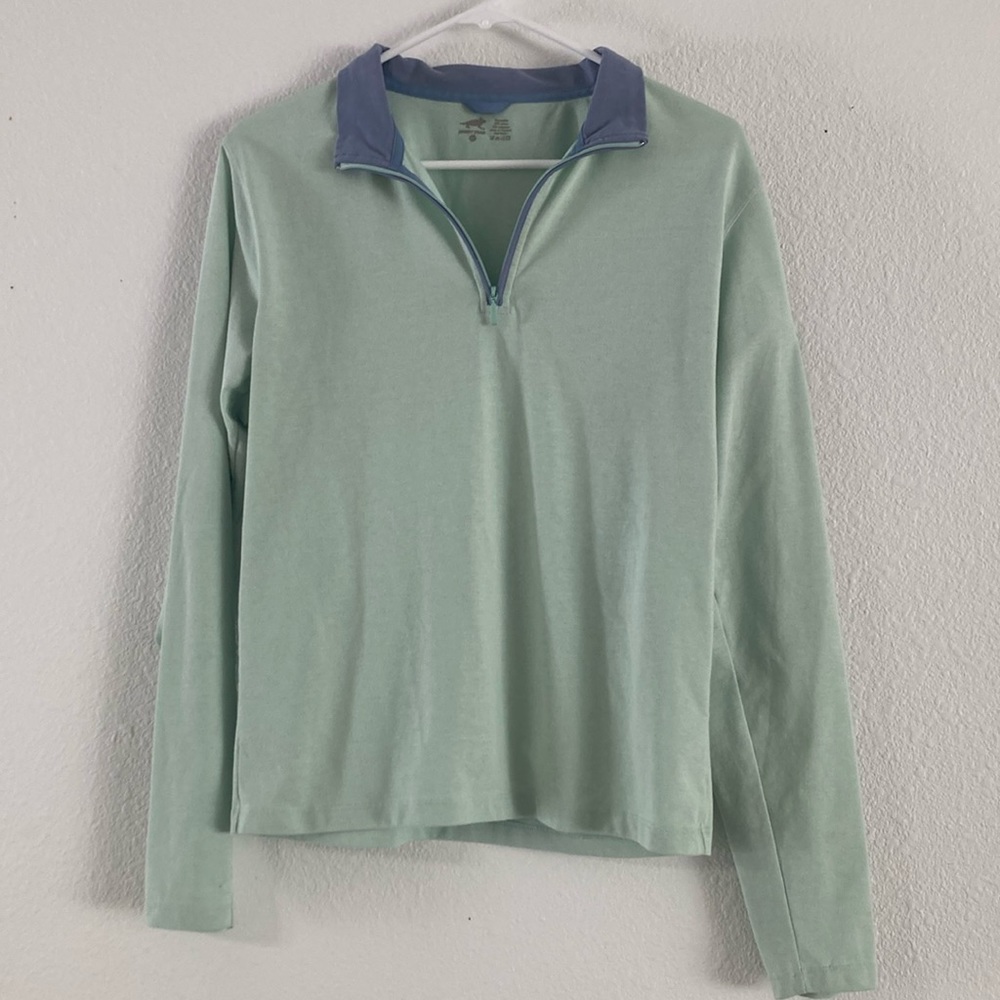 Green and blue half zip shirt